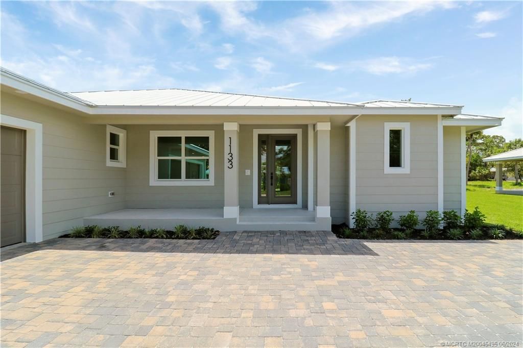 Photo of 1133 NE Orange Avenue, Jensen Beach, FL 34957 (MLS # M20045495)