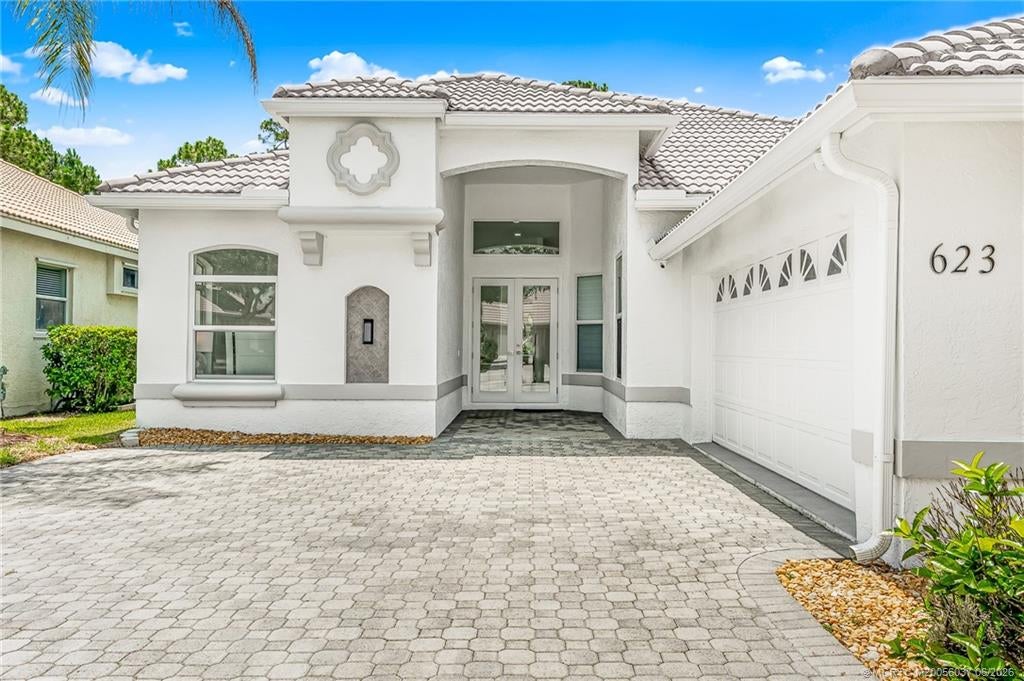 Photo of 623 SW Lake Charles Circle, Port Saint Lucie, FL 34986 (MLS # M20056037)