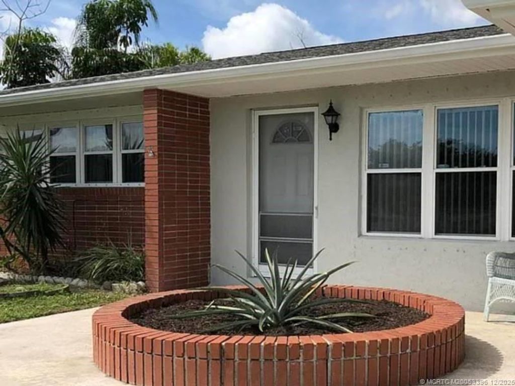 Photo of 874 SW Ivanhoe Drive, Port Saint Lucie, FL 34983 (MLS # M20053396)