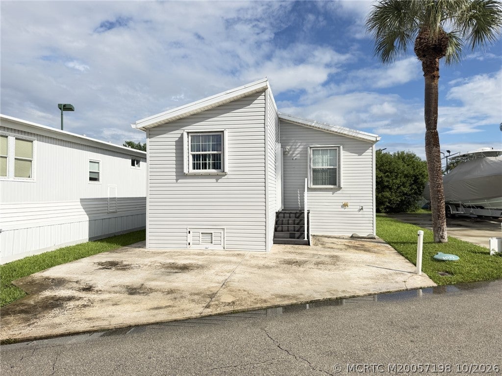 Photo of 1033 Nettles Boulevard, Jensen Beach, FL 34957 (MLS # M20057198)