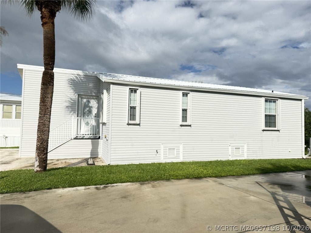 Photo of 1033 Nettles Boulevard, Jensen Beach, FL 34957 (MLS # M20057198)