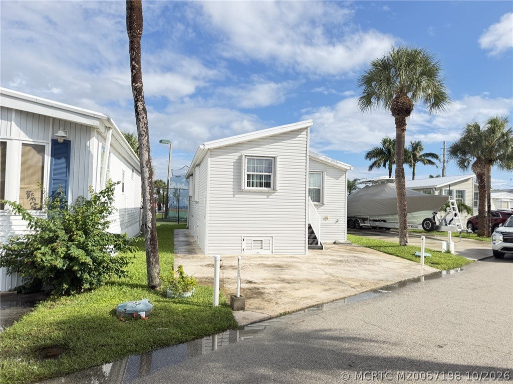Photo of 1033 Nettles Boulevard, Jensen Beach, FL 34957 (MLS # M20057198)