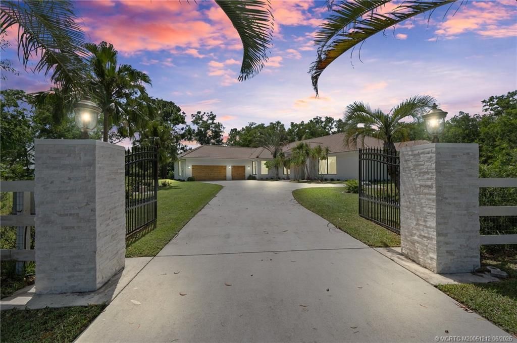 Photo of 9856 SW Pueblo Terrace, Palm City, FL 34990 (MLS # M20051212)