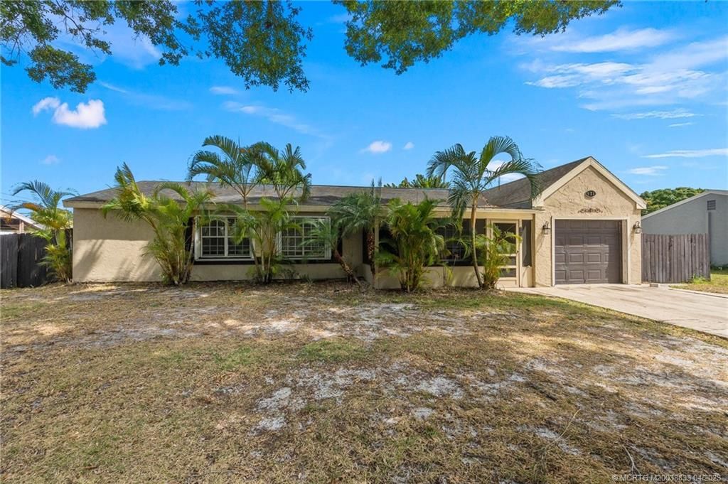 Photo of 571 SE Tanner Avenue, Port Saint Lucie, FL 34984 (MLS # M20038833)