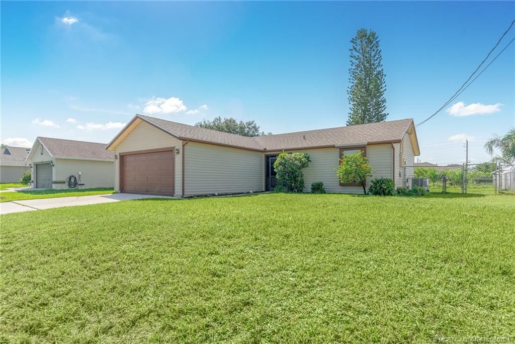 Photo of 952 SW Mccomkle Avenue, Port Saint Lucie, FL 34953 (MLS # M20045878)