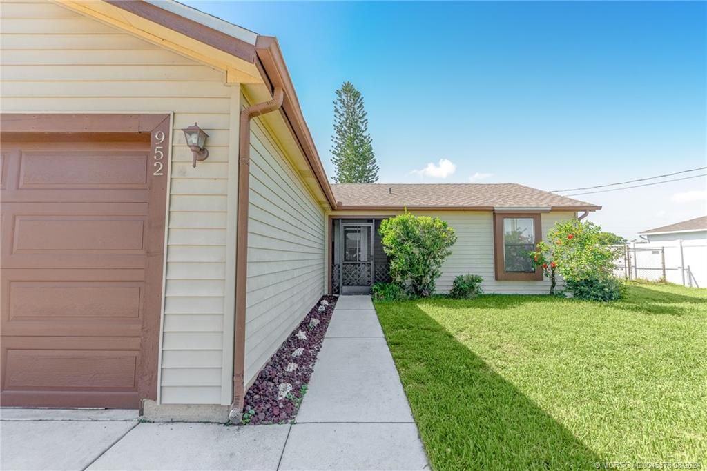 Photo of 952 SW Mccomkle Avenue, Port Saint Lucie, FL 34953 (MLS # M20045878)