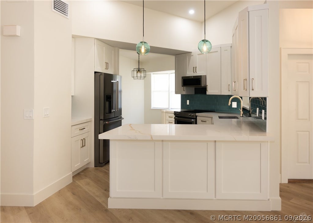Photo of 2425 SW Foxpoint Trail, Palm City, FL 34990 (MLS # M20056861)