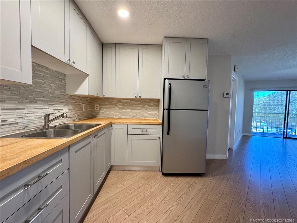 Photo of 2083 NE Collins Circle #8-110, Jensen Beach, FL 34957 (MLS # M20052902)