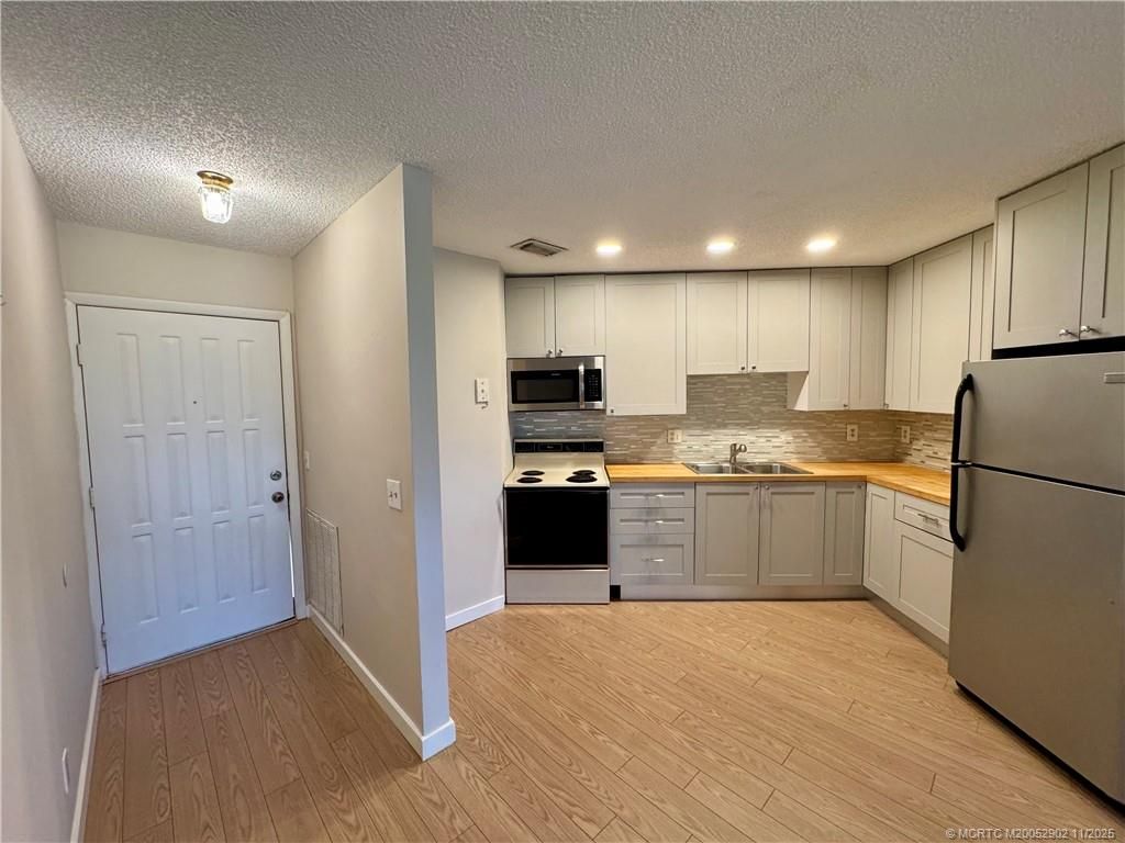 Photo of 2083 NE Collins Circle #8-110, Jensen Beach, FL 34957 (MLS # M20052902)