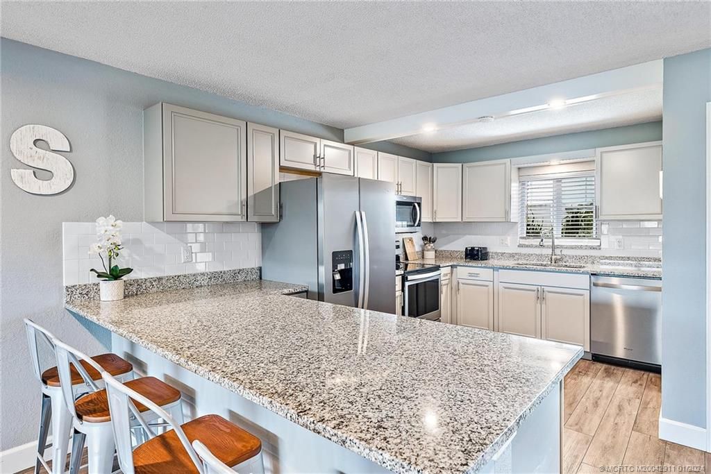 Photo of 1350 NE 14th Court #J28, Jensen Beach, FL 34957 (MLS # M20042911)