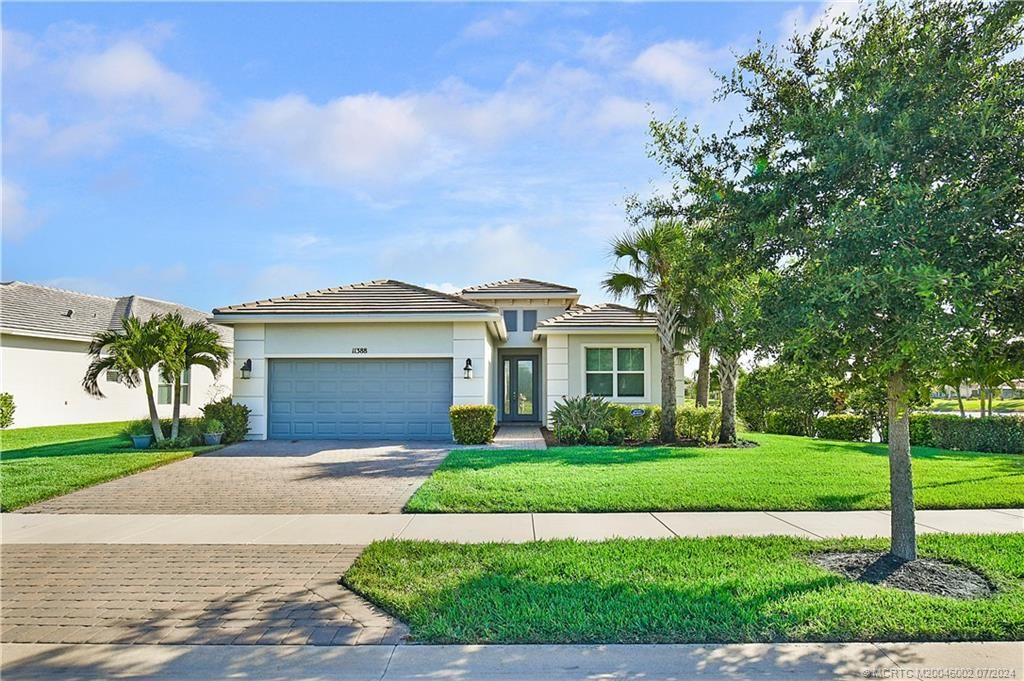 Photo of 11388 SW Lunata Way, Port Saint Lucie, FL 34987 (MLS # M20046002)