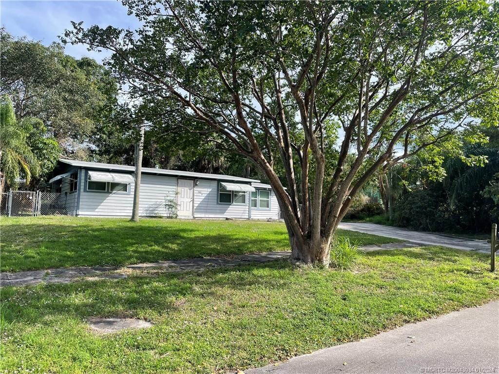 Photo of 1405 NE Waveland Avenue, Jensen Beach, FL 34957 (MLS # M20043034)