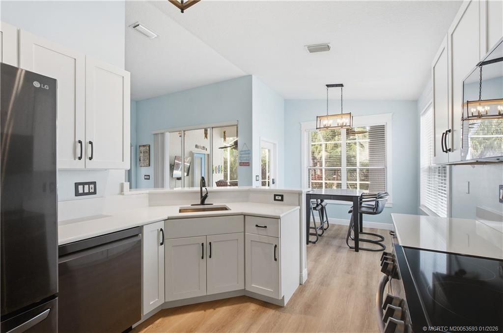 Photo of 884 NW Waterlily Place, Jensen Beach, FL 34957 (MLS # M20053593)