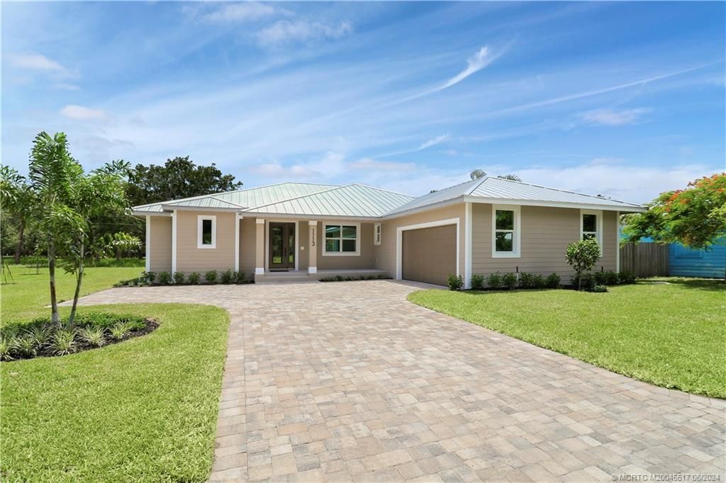 Photo of 1113 NE Orange Avenue, Jensen Beach, FL 34957 (MLS # M20045517)