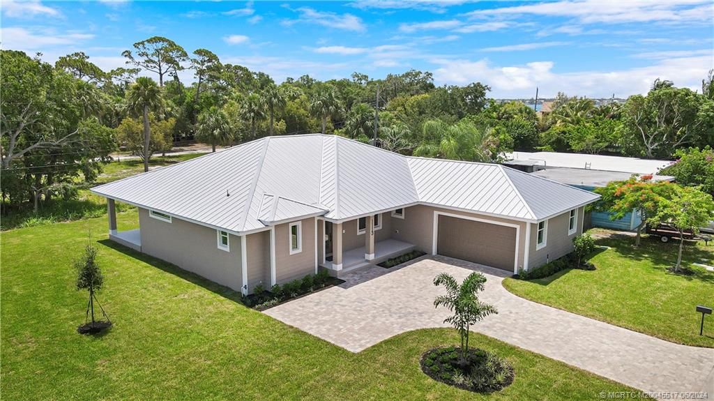 Photo of 1113 NE Orange Avenue, Jensen Beach, FL 34957 (MLS # M20045517)