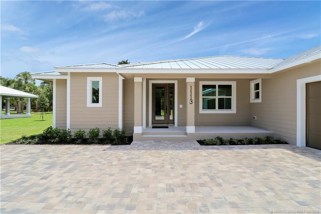 Photo of 1113 NE Orange Avenue, Jensen Beach, FL 34957 (MLS # M20045517)