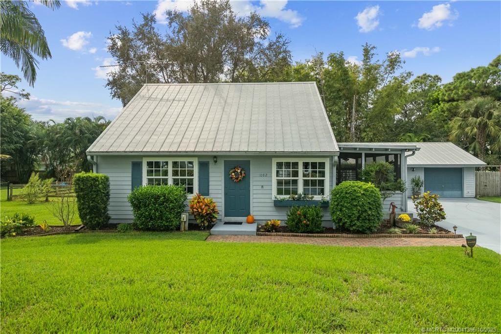 Photo of 1082 SW Pine Tree Lane, Palm City, FL 34990 (MLS # M20041395)