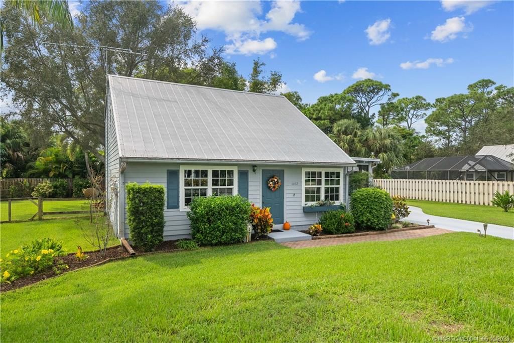 Photo of 1082 SW Pine Tree Lane, Palm City, FL 34990 (MLS # M20041395)