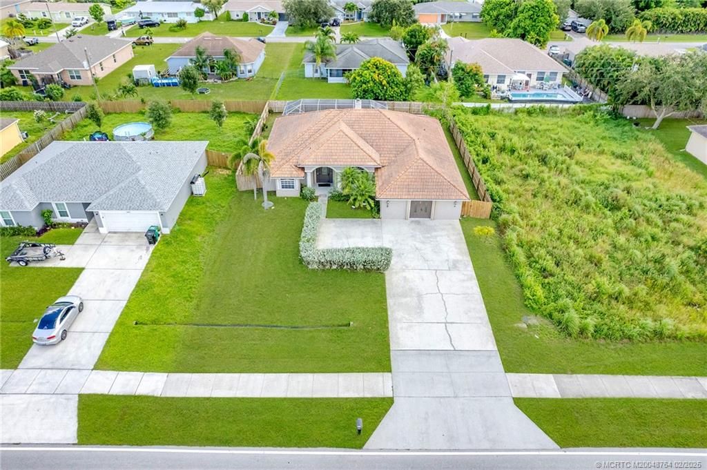 Photo of 341 NW Bayshore Boulevard, Port Saint Lucie, FL 34983 (MLS # M20048764)