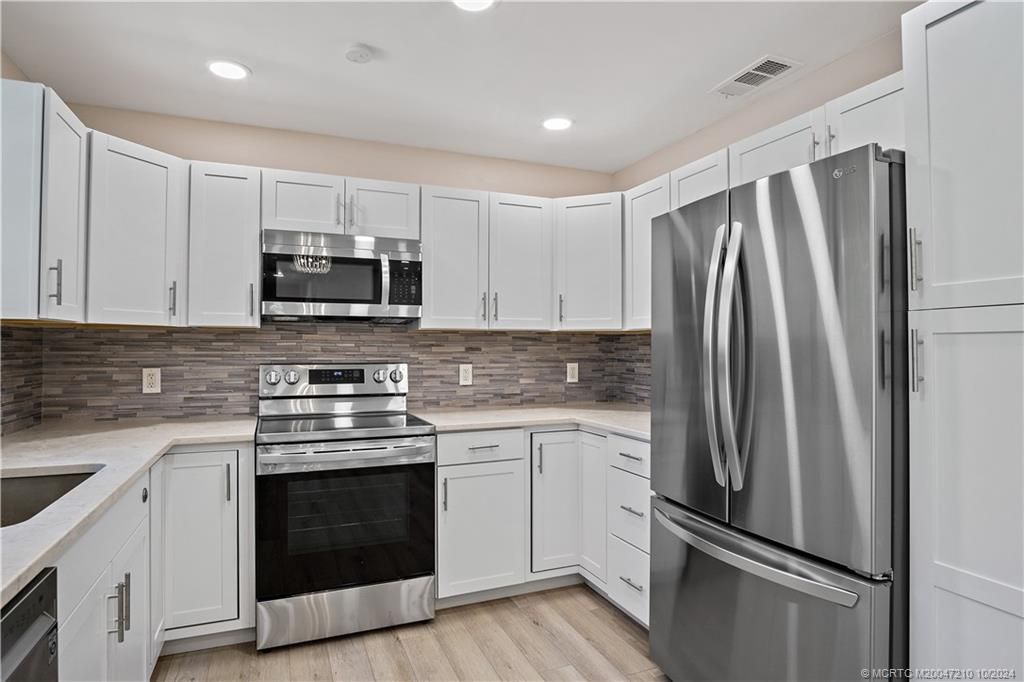 Photo of 1838 NE 21st Terrace, Jensen Beach, FL 34957 (MLS # M20047210)