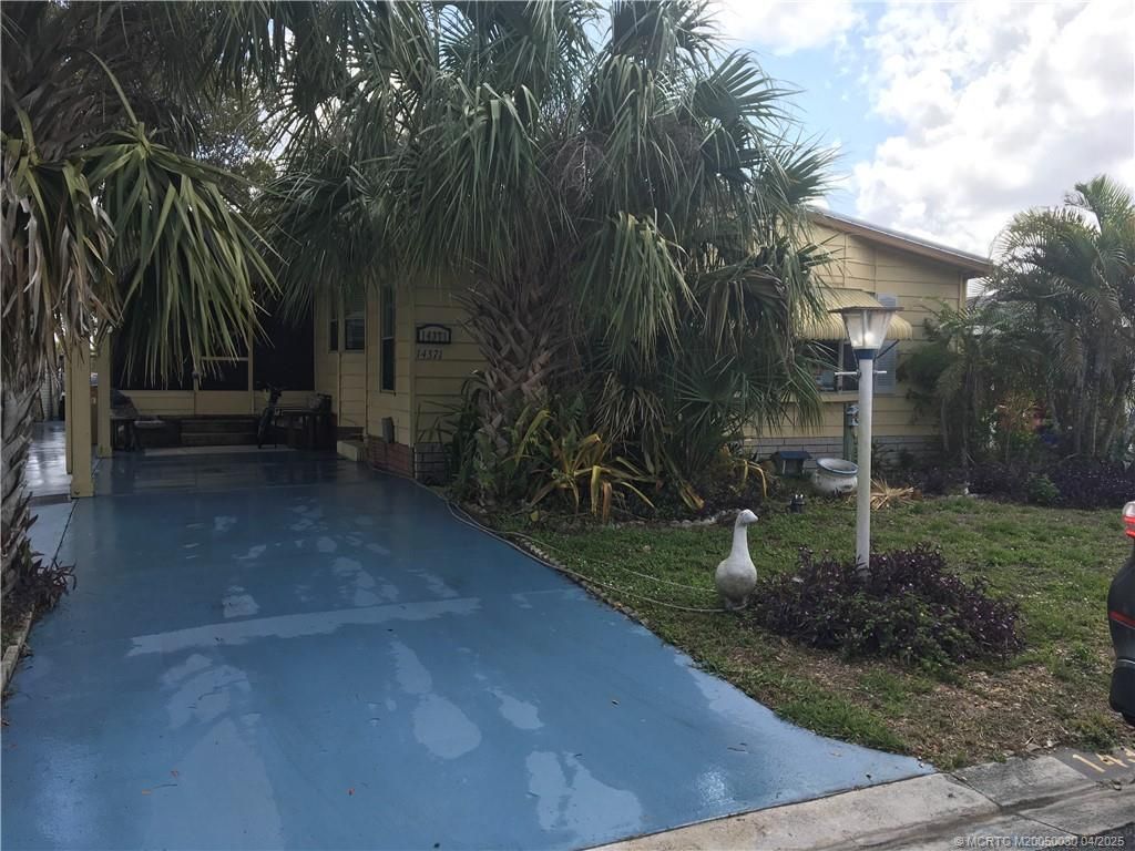 Photo of 14371 SW Divot Drive Drive, Indiantown, FL 34956 (MLS # M20050030)