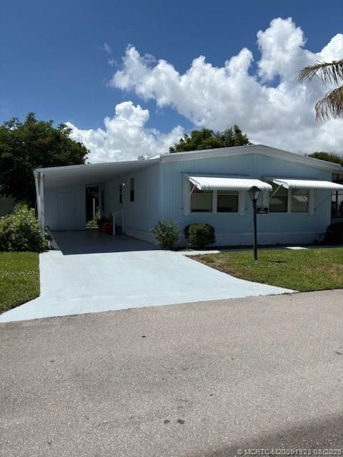 Photo of 443 NE PINELAKE VILLAGE Boulevard, Jensen Beach, FL 34957 (MLS # M20051923)