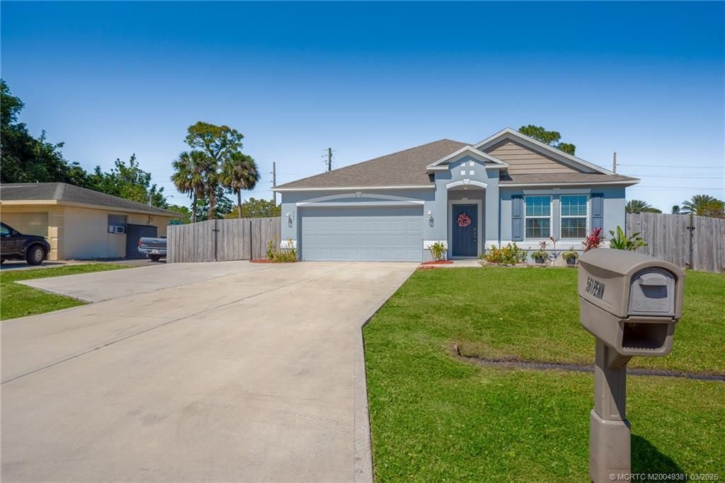 Photo of 561 SE Penn Avenue, Port Saint Lucie, FL 34984 (MLS # M20049381)