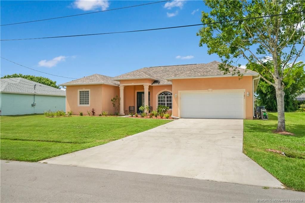 Photo of 1141 SW Ackard Avenue, Port Saint Lucie, FL 34953 (MLS # M20046178)