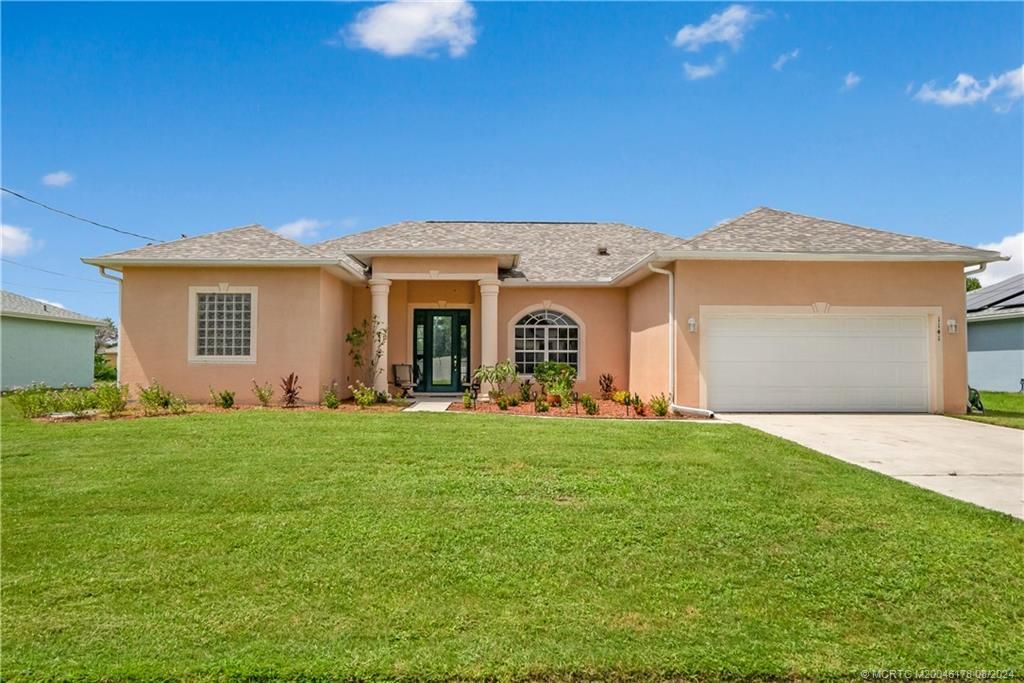 Photo of 1141 SW Ackard Avenue, Port Saint Lucie, FL 34953 (MLS # M20046178)