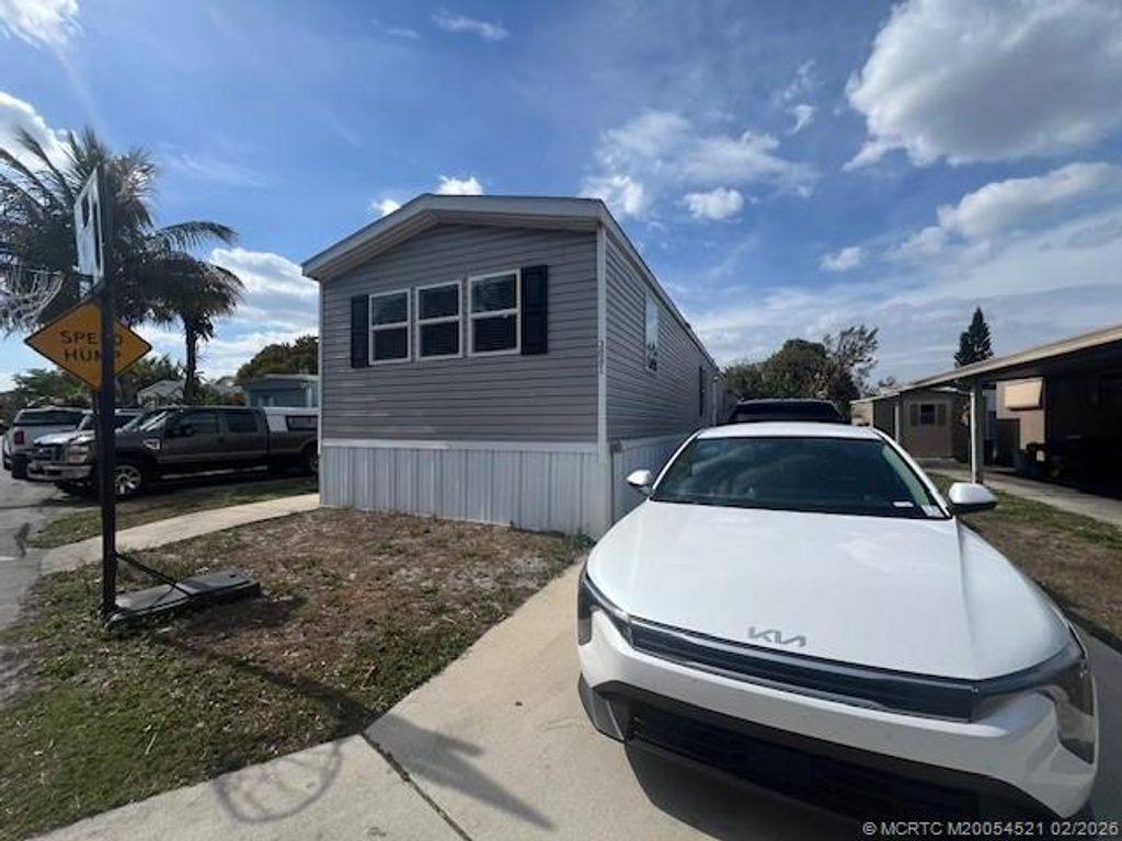 Photo of 3081 E Mayaguana Lane, Lake Worth, FL 33462 (MLS # M20054521)