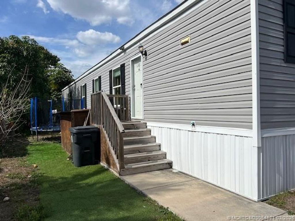 Photo of 3081 E Mayaguana Lane, Lake Worth, FL 33462 (MLS # M20054521)