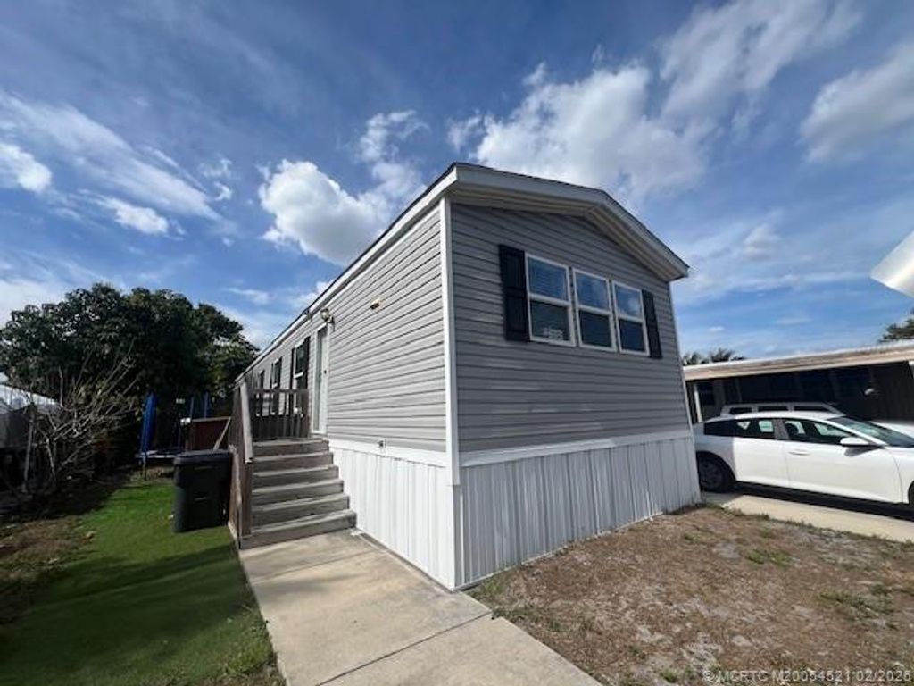 Photo of 3081 E Mayaguana Lane, Lake Worth, FL 33462 (MLS # M20054521)