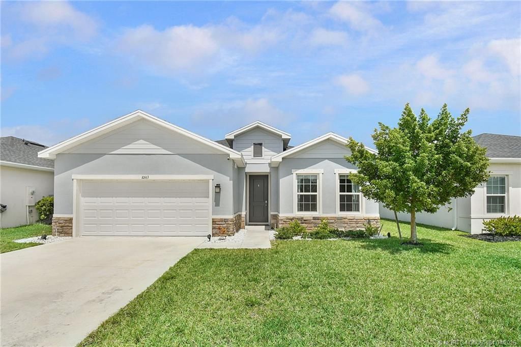 Photo of 10663 SW Vasari Way, Port Saint Lucie, FL 34987 (MLS # M20050164)