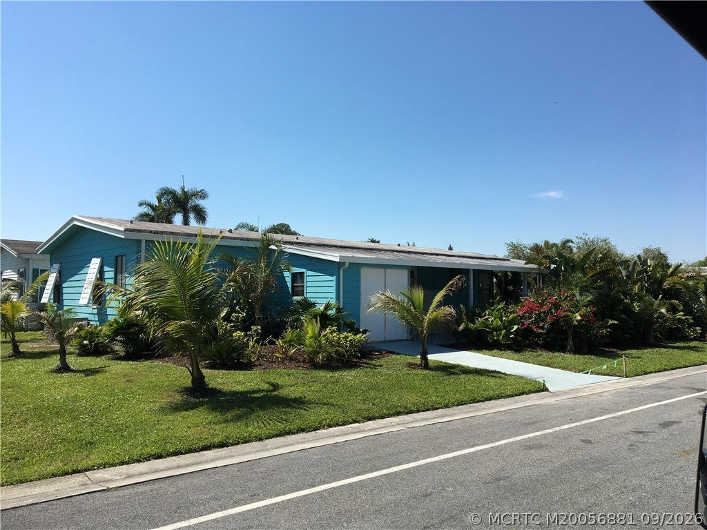 Photo of 14383 SW Rake Drive DR #E-22, Indiantown, FL 34956 (MLS # M20056881)