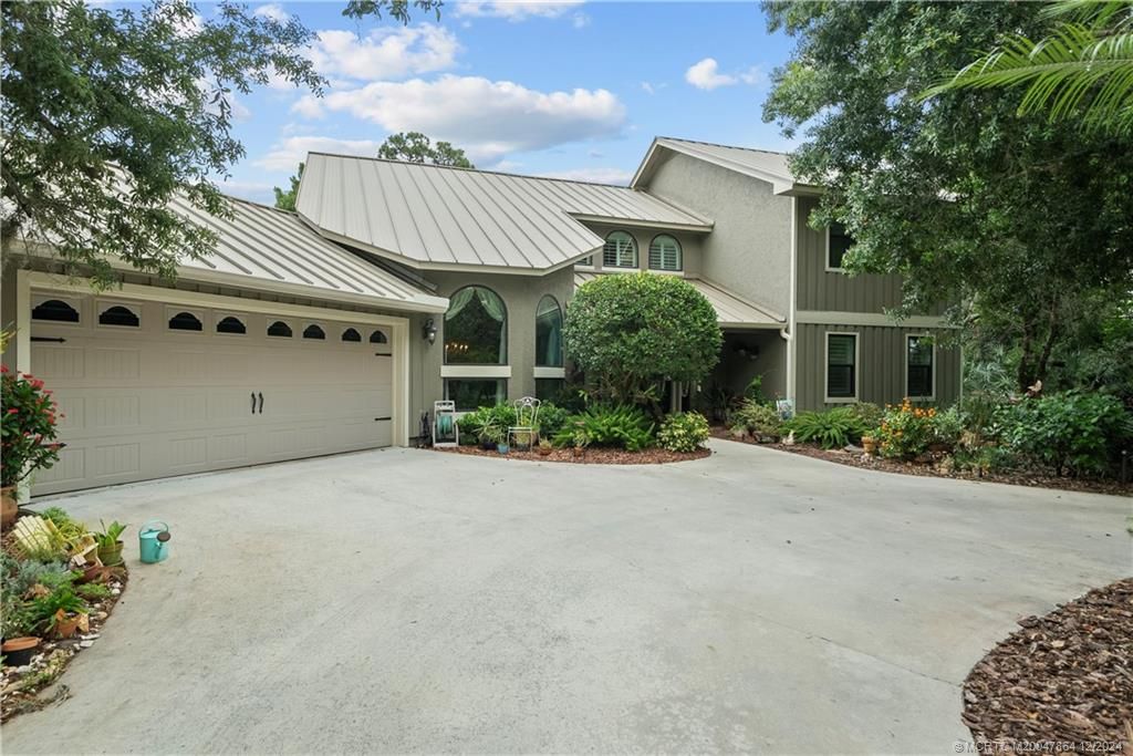 Photo of 2002 SW Racquet Club Drive, Palm City, FL 34990 (MLS # M20047864)