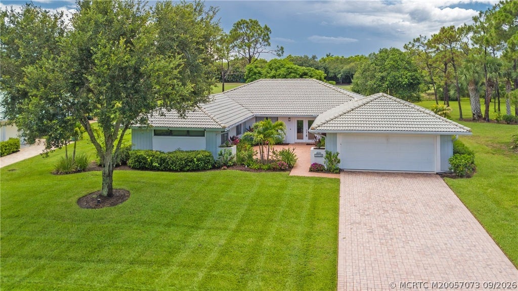 Photo of 1463 SW Troon Circle, Palm City, FL 34990 (MLS # M20057073)
