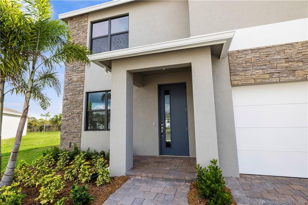 Photo of 2048 NE Ocean Dunes Drive, Jensen Beach, FL 34957 (MLS # M20042201)