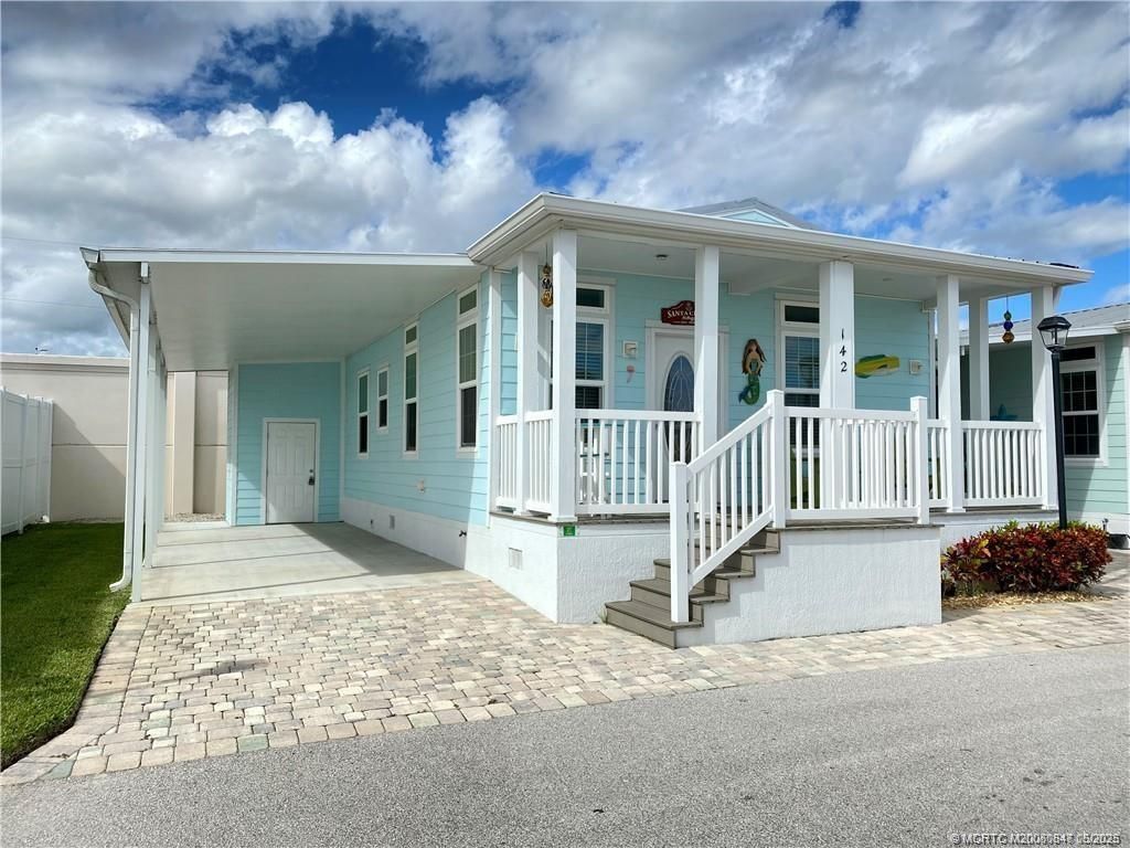 Photo of 142 NE Coastal Drive, Jensen Beach, FL 34957 (MLS # M20050847)