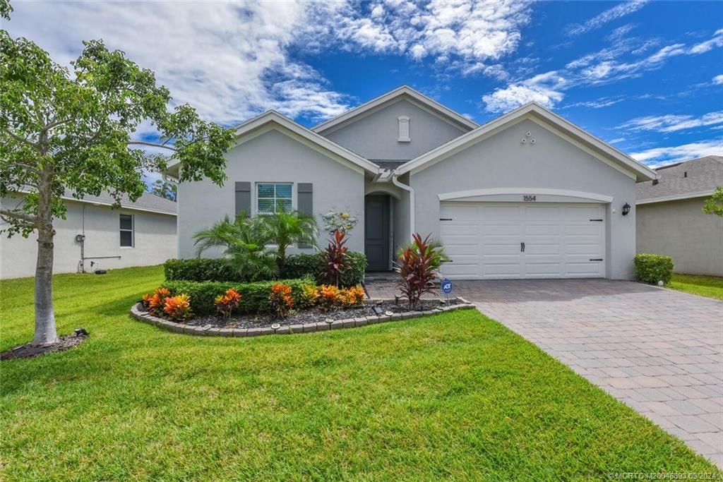 Photo of 1554 NE White Pine Terrace, Jensen Beach, FL 34957 (MLS # M20046893)