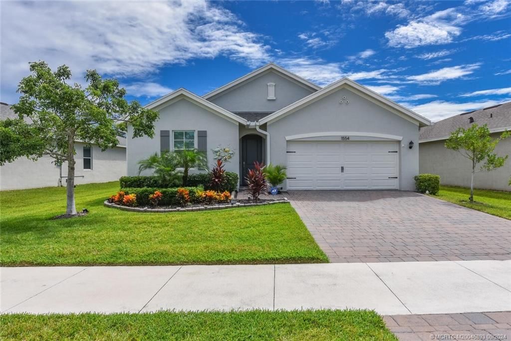 Photo of 1554 NE White Pine Terrace, Jensen Beach, FL 34957 (MLS # M20046893)