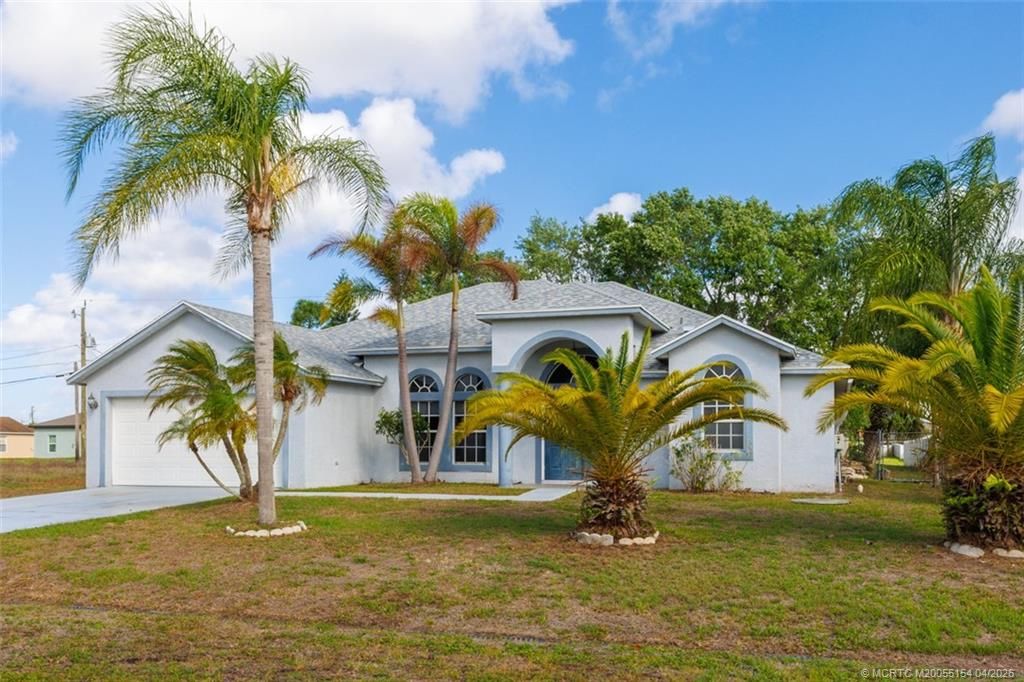 Photo of 409 SW Prater Avenue, Port Saint Lucie, FL 34953 (MLS # M20055154)