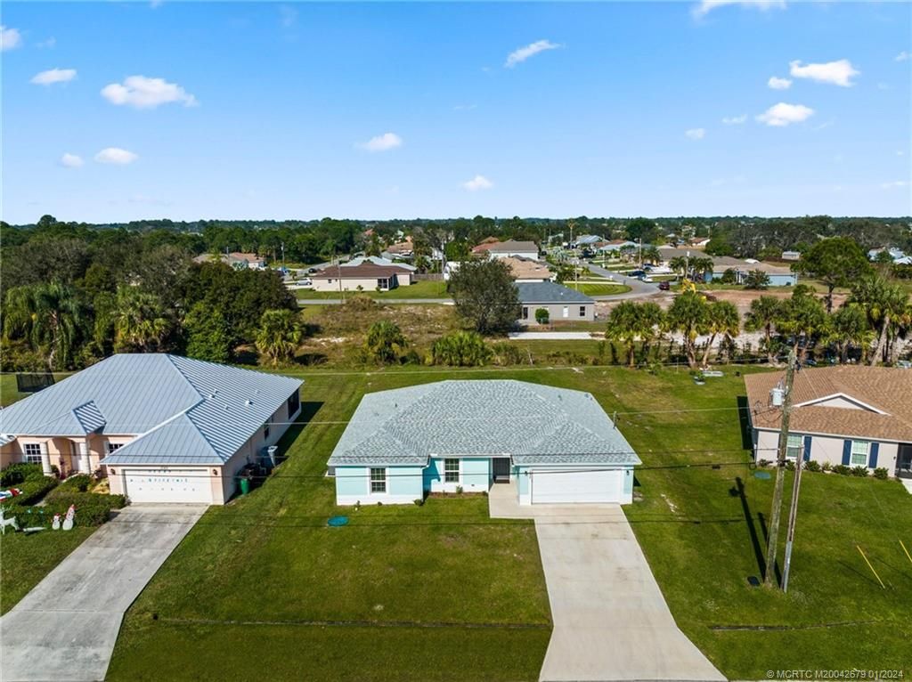 Photo of 1033 SW Ingrassina Avenue, Port Saint Lucie, FL 34953 (MLS # M20042679)