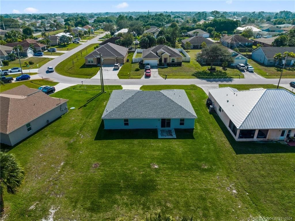 Photo of 1033 SW Ingrassina Avenue, Port Saint Lucie, FL 34953 (MLS # M20042679)