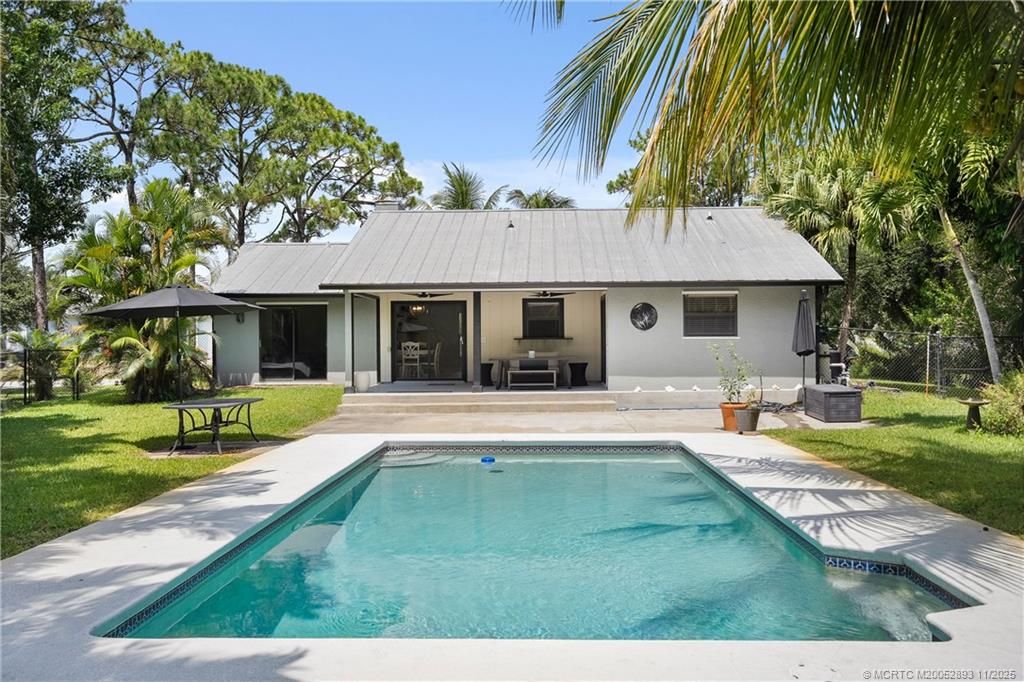 Photo of 6361 SE Phillips Bend Avenue, Stuart, FL 34997 (MLS # M20052893)