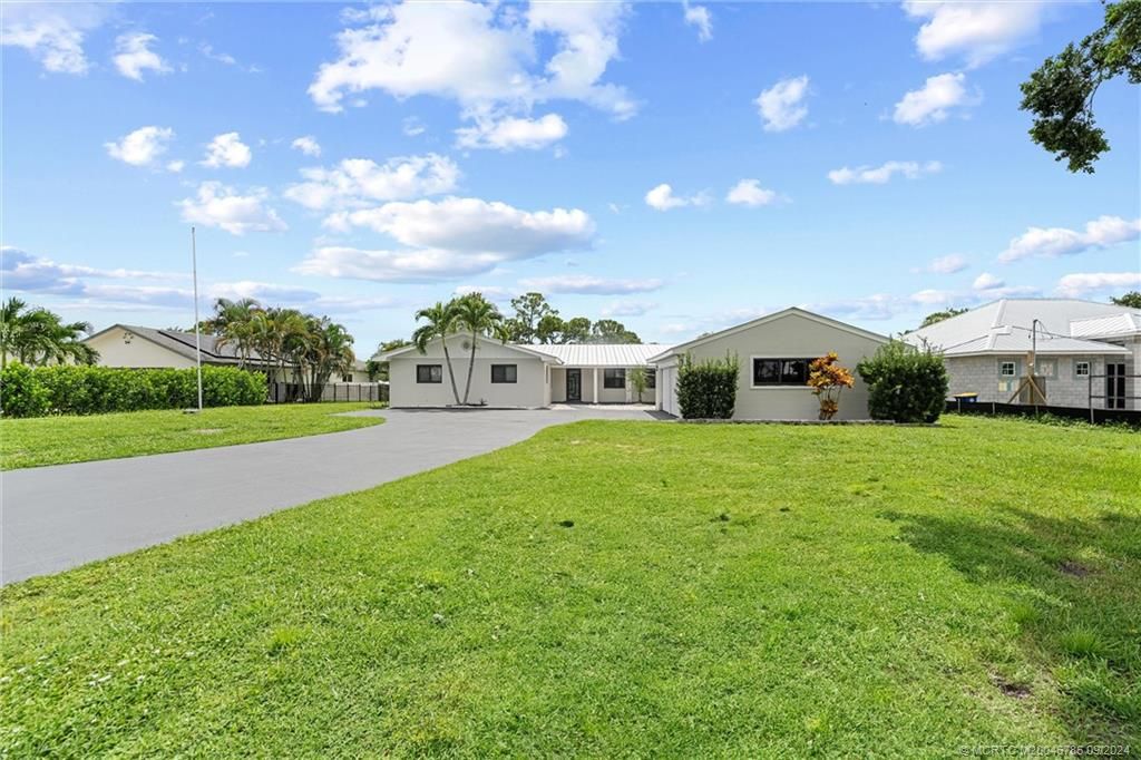 Photo of 1134 NW Spruce Ridge Drive, Stuart, FL 34994 (MLS # M20046786)