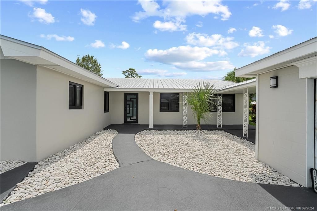 Photo of 1134 NW Spruce Ridge Drive, Stuart, FL 34994 (MLS # M20046786)