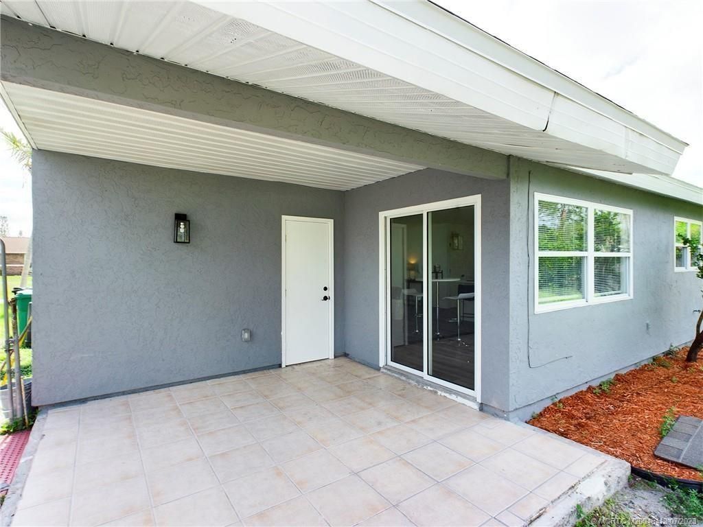 Photo of 161 SW Dalva Avenue, Port Saint Lucie, FL 34984 (MLS # M20040413)