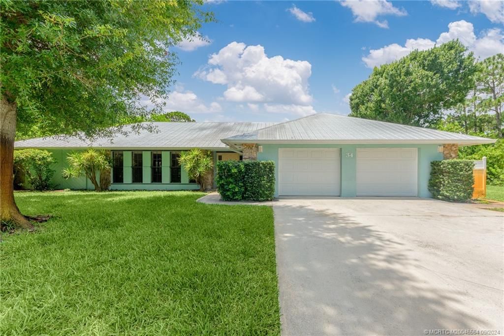 Photo of 34 NE Acacia Trail, Jensen Beach, FL 34957 (MLS # M20046564)