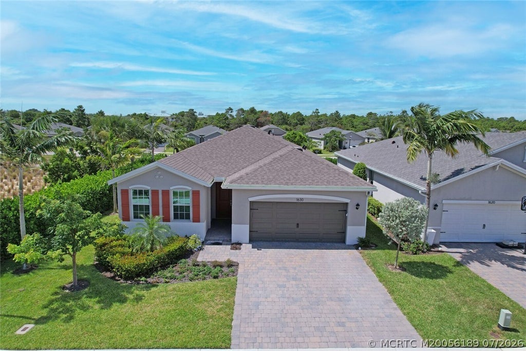 Photo of 1630 NE Skyhigh Terrace, Jensen Beach, FL 34957 (MLS # M20056189)