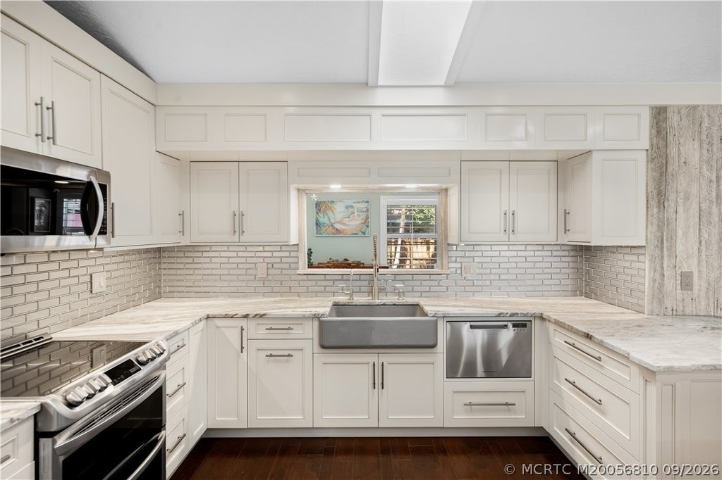 Photo of 2040 NE Acapulco Drive, Jensen Beach, FL 34957 (MLS # M20056810)
